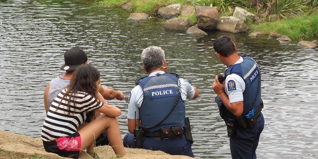 Police interview witnesses. Photo / Peter de Graaf