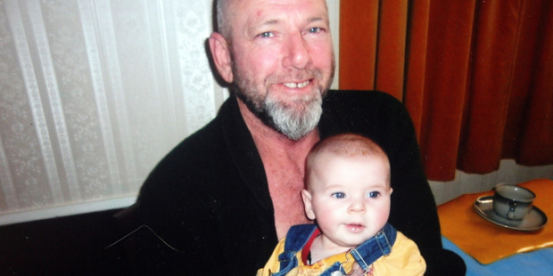 Marc Burgiss, 55, of Greytown, who died when he lost control of his motorcycle on Sunday, pictured holding his grand-nephew Lennox Roigard. PHOTO/SUPPLIED