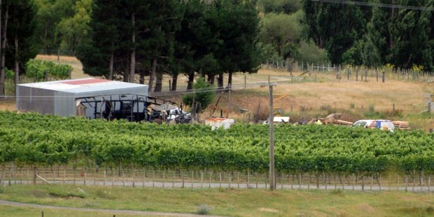 The heat-buckled remnants of a large storage shed that was razed in a midnight fire at Murdoch James Estate Winery near Martinborough overnight Wednesday. PHOTO/NATHAN CROMBIE