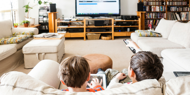 According to a survey by research agency Childwise, children aged five to 16 now spend more time online each day than they do watching conventional television. Photo / iStock