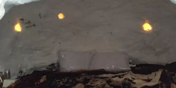 The igloo's cozy interior included warm blankets and lights embedded in the walls. Photo / Airbnb