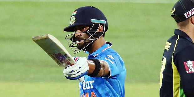 Virat Kohli celebrates reaching 50. Photo / Getty