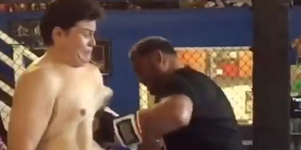Emiliano Rivera absorbs Mark Hunt's powerful body shot. Photo / YouTube