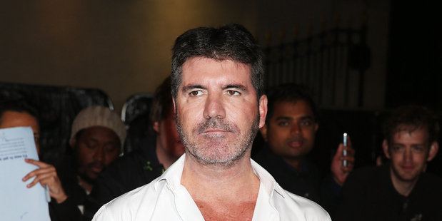 Simon Cowell has spoken about his feelings on former One Direction member Zayn Malik. Photo / Getty