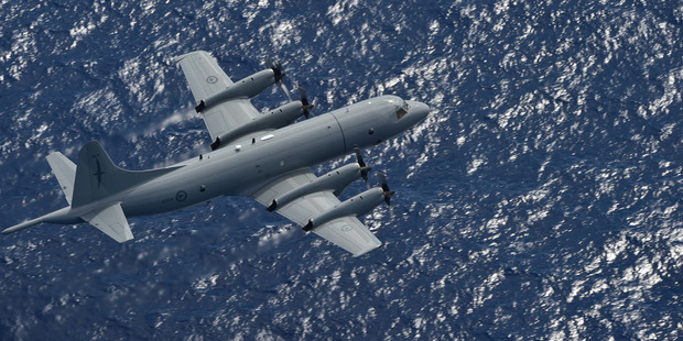 A RNZAF Orion P-3K2 is expected to reach the search area off Kiribati around 2.30pm today to help search for three fishermen. Photo / Supplied