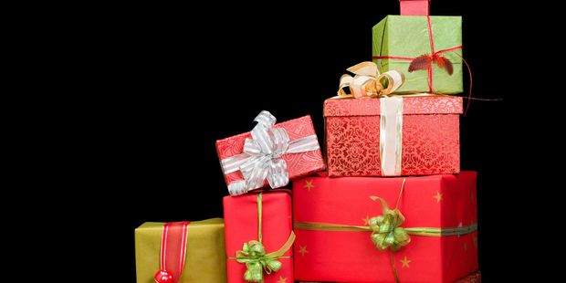 64485518 - beautiful stack of christmas presents with ribbons and bows