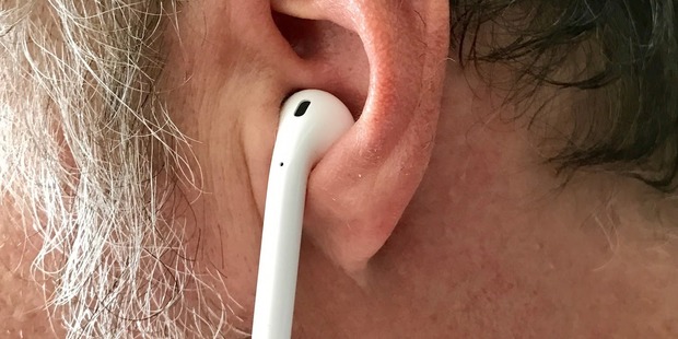 They look unusual, and you wouldn't think Apple's tiny AirPods would stay securely in your ear, but they do. Photo / Juha Saarinen