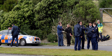 Police at the entry to the Wainuiomata summit track where Graeme Burton was caught by police. 6 January 2007 to Herald on Sunday Photograph by Anthony Phelps