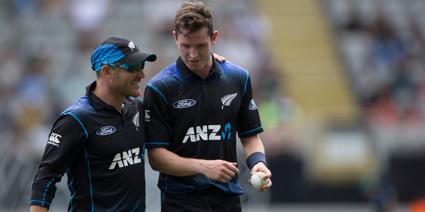 Brendon McCullum congratulates Adam Milne after his wicket. Photo / Greg Bowker