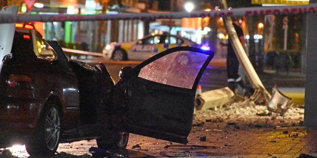 The scene of the crash shows the wrecked Honda Civic on Masterton's Queen St. Photo / Phil Brazier 