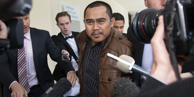 Muhammad Rizalman runs the media gauntlet after a court appearance in 2014. Photo / Getty Images