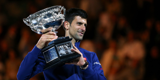 Novak Djokovic of Serbia holds the Norman Brookes Challenge Cup after winning the Men's Singles Final over Andy Murray of Great Britain. Photo / Getty Images