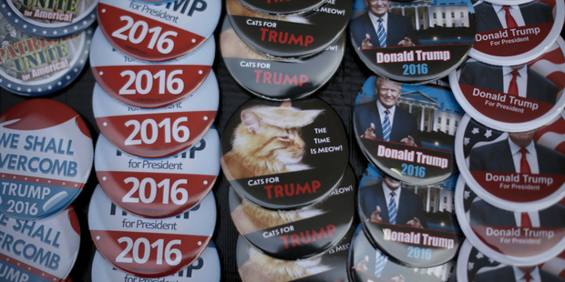 Campaign buttons sit for sale before a Trump campaign rally in Council Bluffs, Iowa. Photo / Getty Images
