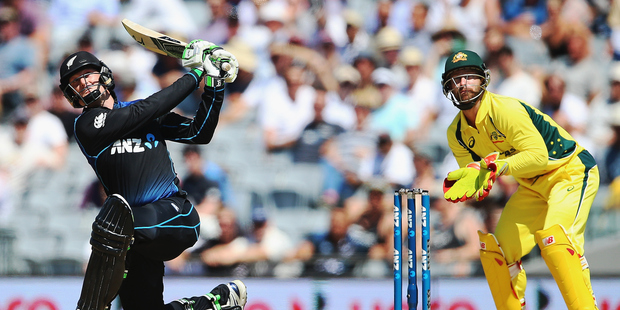 Martin Guptill's Eden Park feat isn't the first time he's done this. He is the only batsman to put two sixes on the roof of Westpac Stadium. Photo / Getty Images