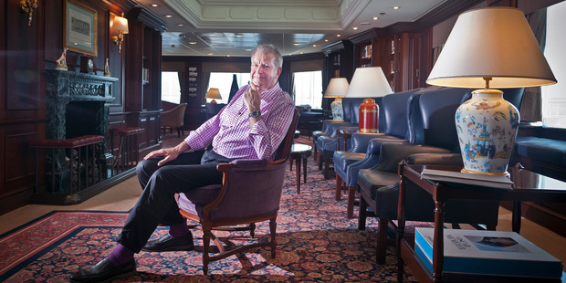 RCL Cruises's head of sales Australia and New Zealand Peter McCormack in the drawing room, with marble fireplace, hand-painted ceiling and plush leather chairs. Photo / Andrew Warner