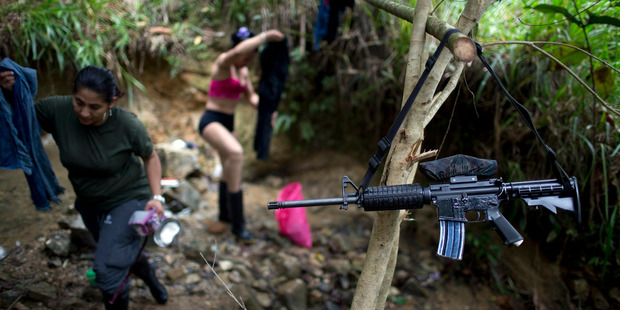 There were Farc fighters wearing lipsticks, bathing in creeks and cuddling up to their male companions. Photo / AP.