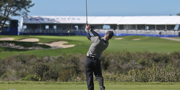 A 22-year-old self-styled amateur "golf scientist" is challenging traditional methods and the best players with his new take on the golf swing. Photo / AP.