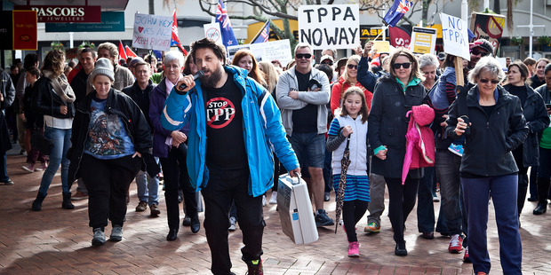 Tauranga TPPA Action Network members protested in August. Some members will be amid the protest action as the Trans-Pacific Partnership Agreement is signed at SkyCity tomorrow.