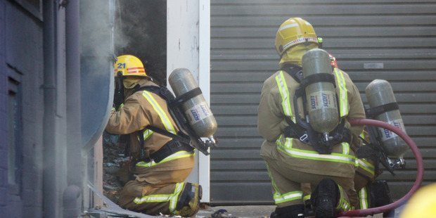 Fire crews respond to a kitchen fire at Beach Babylon Cafe. Photo: SNPA / Derek Quinn