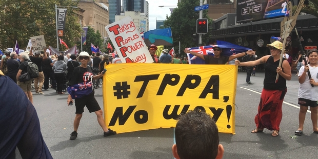 OPPOSITION: Members of the Tauranga TPP Action Network marching down Queen St, Auckland, to protest the signing of the TPPA. PHOTO/SUPPLIED