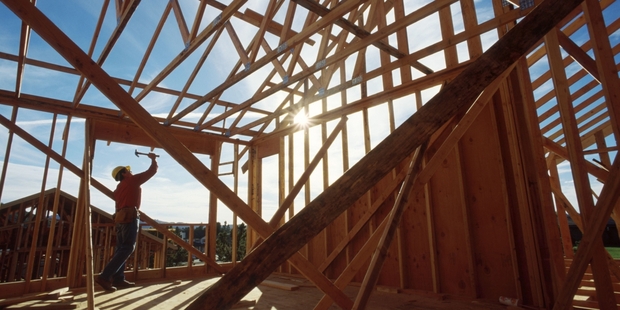 The planned tax change will require overseas-based traders who buy then sell within two years to pay resident withholding tax.