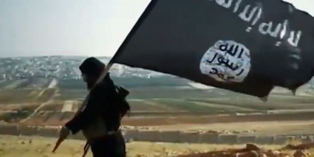 The latest killing video from Isis (Islamic State) features a blond-haired Frenchman. Photo of Isis flag / YouTube