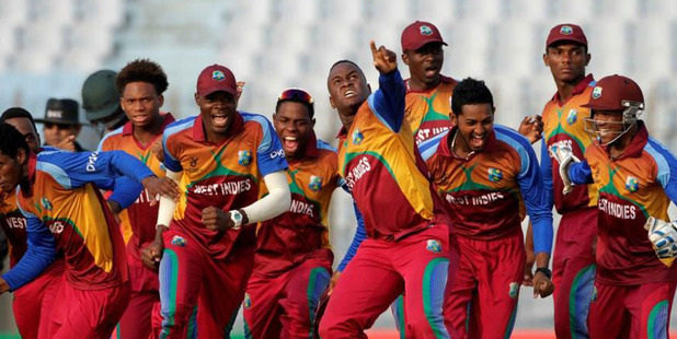 The West Indies players celebrate their controversial win.