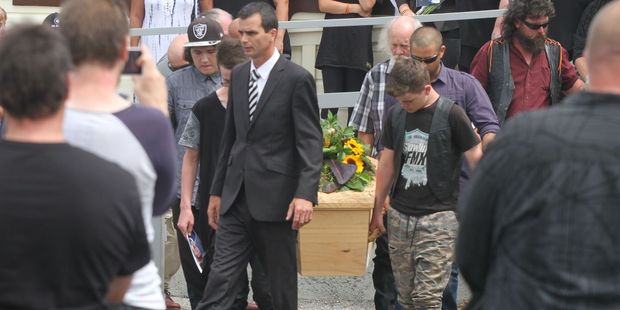 Pacer's casket was adorned with flowers and messages of farewell inked on the side. Photo / Andrew Bonallack, Wairarapa Times-Age
