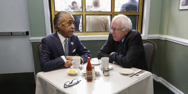 Bernie Sanders sits down for breakfast with the Rev Al Sharpton at Sylvia's Restaurant in Harlem.