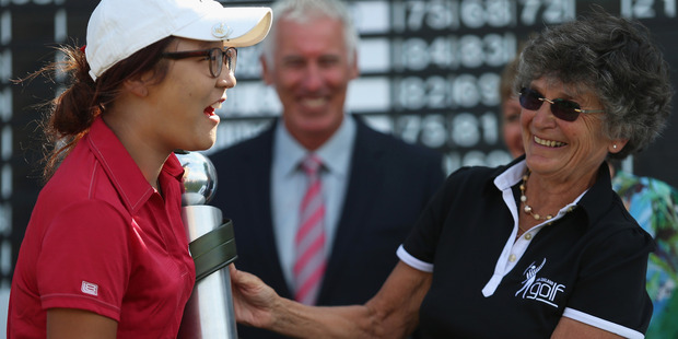 Lydia Ko was presented the New Zealand Women's Open trophy by Patsy Hankins in 2013. Photo / Getty