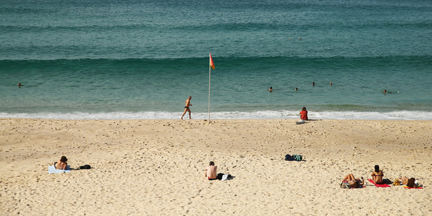 The baby boy was lying next to his mother on Bronte Beach when a man tried to grab the child. Photo / Getty