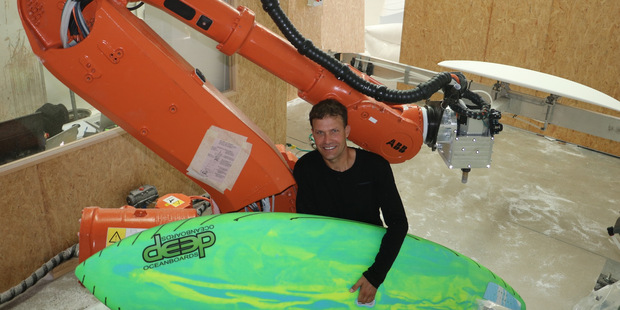 Kinaroad chief executive Scott Fenton says his surf board shaping robots can produce 7000 boards a year. Photo / Supplied