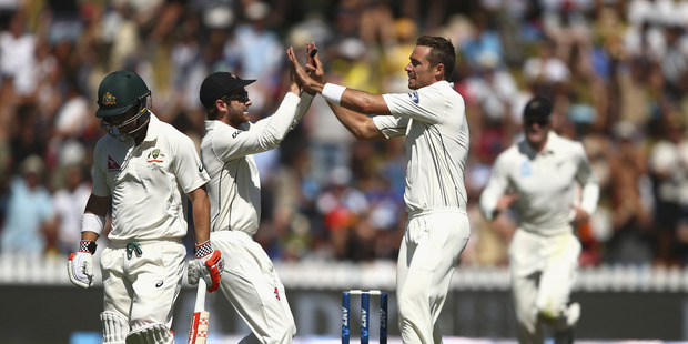 Tim Southee of New Zealand celebrates after taking the wicket of David Warner of Australia during day one of the Test match between New Zealand and Australia. Photo / Getty Images.