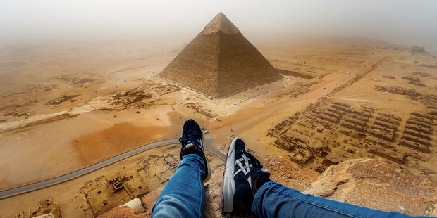 People have been scrambling up the sides of the pyramids for centuries - but most of them didn't have iPhone 6s and Twitter accounts. Photo / Andrej Ciesielski / Caters News