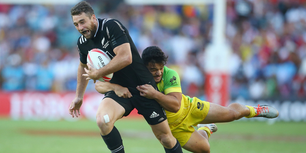 Joe Webber of New Zealand is tackled by Allan Fa'alava'au of Australia during the 2016 Sydney Sevens cup final match. Photo / Getty Images