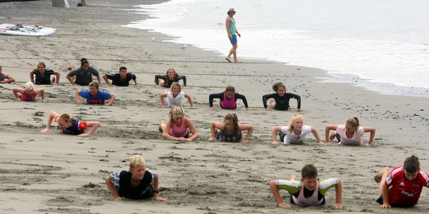 The Nippers surf lifesavers from Westshore, Napier, train in overcast conditions yesterday. Photo / Paul Taylor