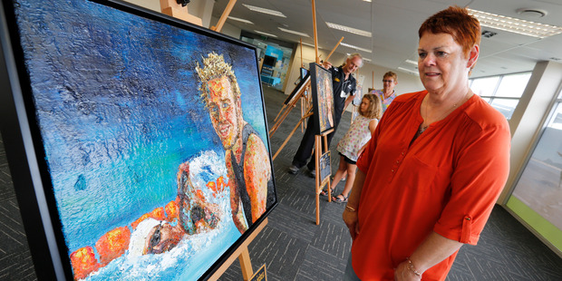 Jan Peck from Ruakaka checks out the painting of Paralympian Cameron Leslie in the Kauri Room at the Hub, at Whangarei Town Basin. Photo / John Stone