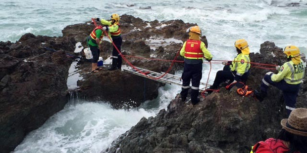 The rescue of two visitors stranded by the high tide while fishing off rocks has prompted a police warning for people to keep a close eye on sea conditions. Photo / Supplied