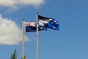 New Zealanders will soon vote whether to keep the current flag, left, or the silver fern on a blue and black background flag, in the upcoming referendum. These flags are flying atop Forum North, in Whangarei. Photo / Mike Dinsdale
