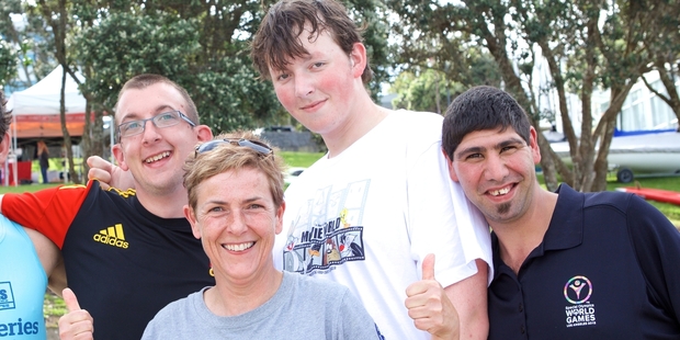 Special Olympics swimmers (from left) Daniel Casbolt, Tate Pishon and Troy Rangi with head coach Sarah O'Dwyer (front). Photo / Scottie T Photography