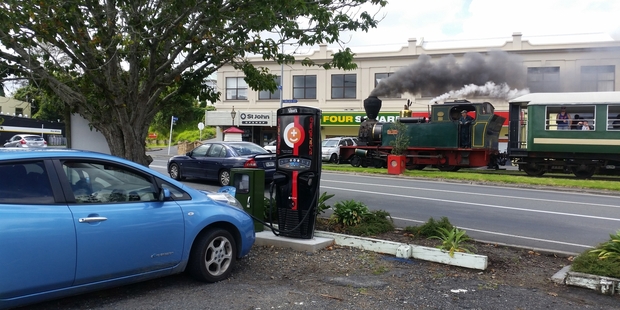 TWO WORLDS: Ninteenth-century technology puffs its way along Kawakawa's main street while 21st century technology stands ready.