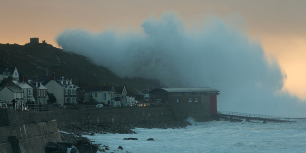 Waves crash over the cliffs at Sennen near Land's End in Cornwall, England. Photo / Getty Images