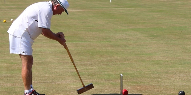 Joe Hogan from Gisborne, the first-ever world croquet champion, competing in the New Zealand men's singles championships at the Rangatira greens.
