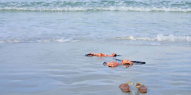 Do something you'd never do at home - like skinny dipping. Photo . 123RF