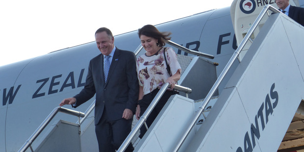 Prime Minister John Key and Bronagh Key arriving in Syndey last night. He has agreed to release a text from gossip columnist Rachel Glucina. Photo / Audrey Young
