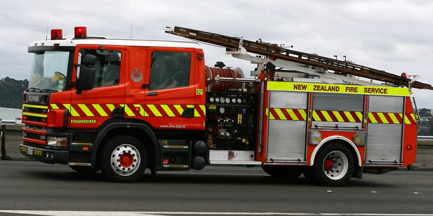 The car fire on the Southern Motorway has been brought under control. Photo / Wayne Drought