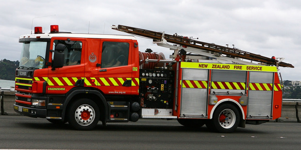 Firefighters were able to contain the fire to the downstairs section of the house because of the quick reactions of neighbours. Photo / Wayne Drought