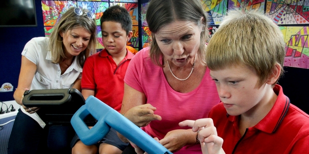 Sign language teacher Kath Shepherd (left) works with hearing-impaired student Starr Phillips and Averill Wilbraham works with hearing impaired student Dontaey Hill at Ebbett Park School, Hastings. Photo / Warren Buckland