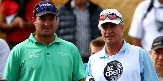 Ryan Fox with his father and caddy Grant Fox during the 2014 New Zealand Open. Photo / Getty Images