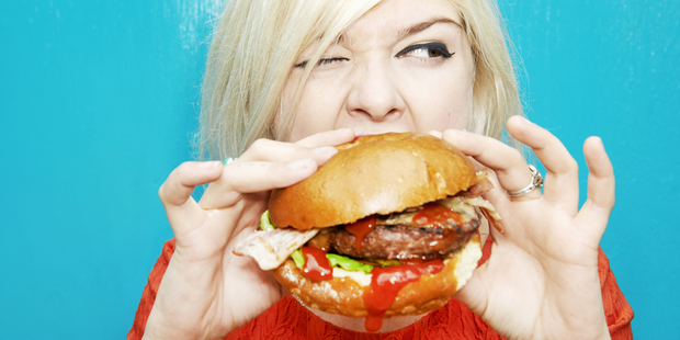 Our easy access to junk food means we're inclined to eat it whether we're actually hungry or not. Photo / Getty